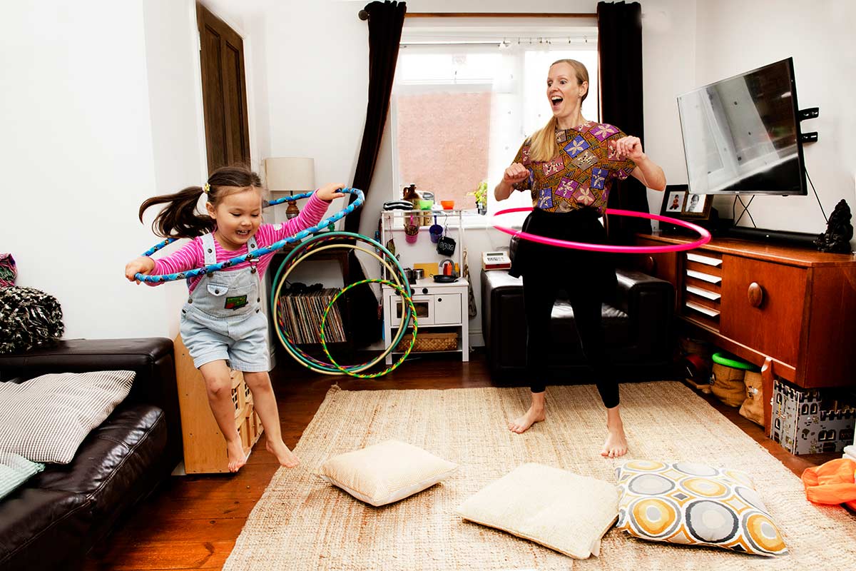 Debbie and her daughter hula-hooping together at home.